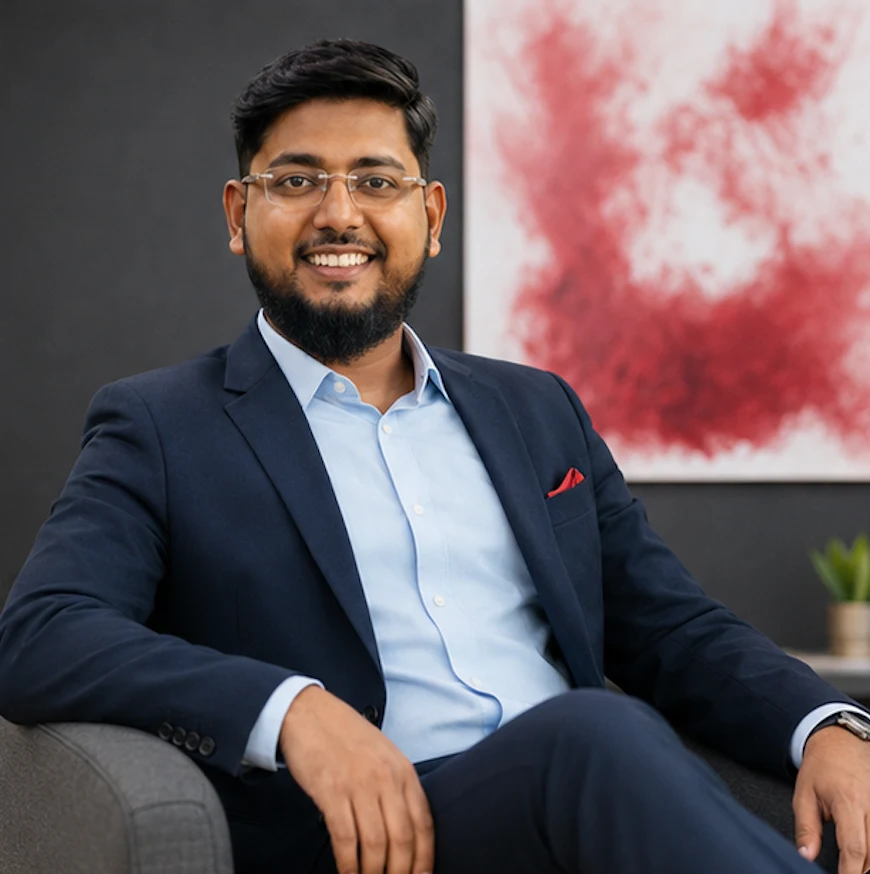 Shahbaz Ahmed Khan, Director of Operations and Workforce Solutions in a blue executive suit